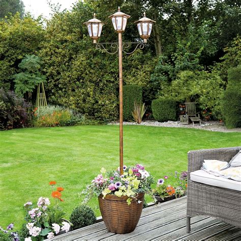 solar lamp post planter|lamp post with planter base.